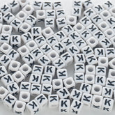 BD00122-02-black-letter-white-opaque-cube-alphabet-beads-single-k-7mm